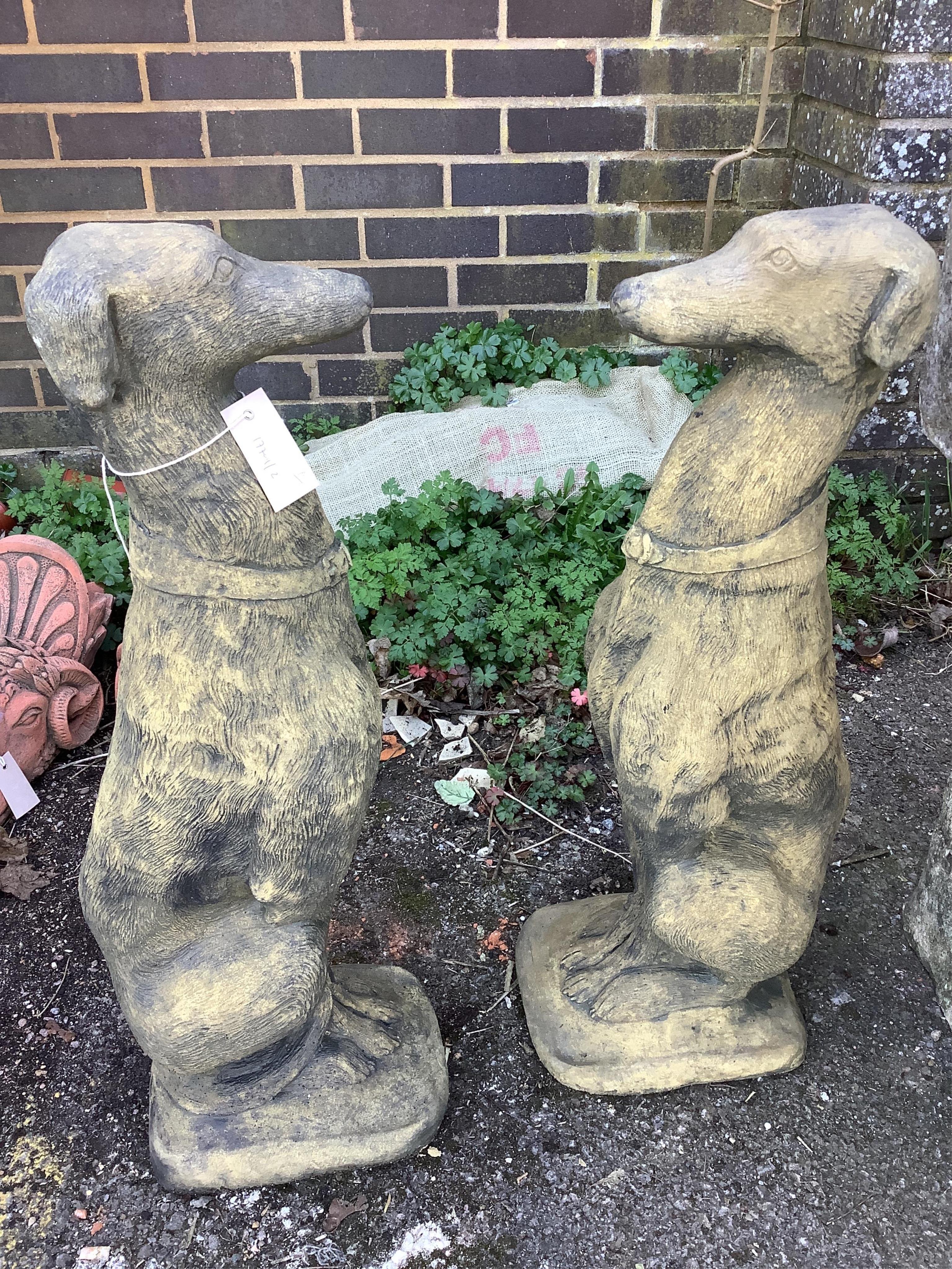 A pair of cast seated greyhound garden ornaments, height 74cm. Condition - good